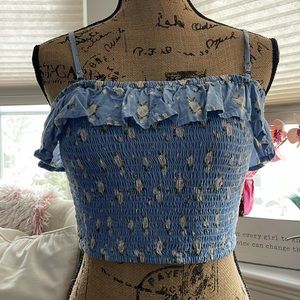Hollister crop top tank, blue with ruffles at the top and white flowers.